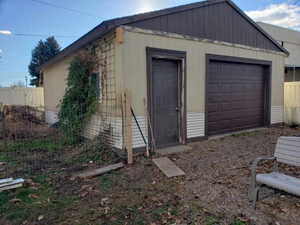 View of outbuilding with a garage