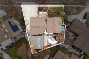 Aerial perspective of suburban area featuring property parcel outlined