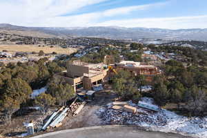 Snowy aerial view featuring a mountain view