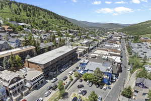 Aerial view of property's location featuring a mountain backdrop