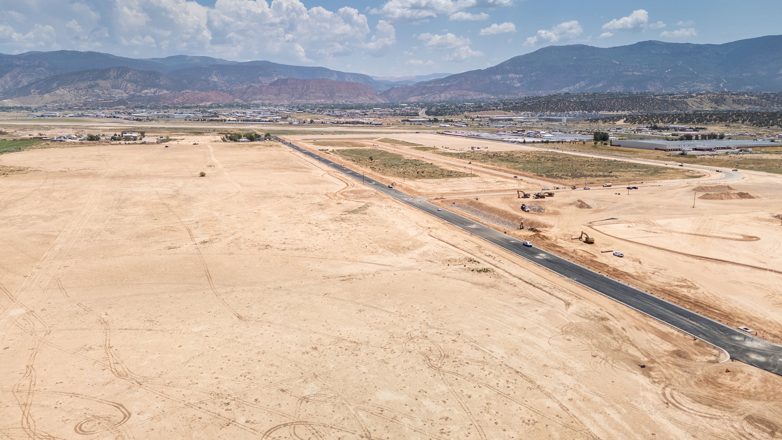 View of rural area with a mountainous background and a desert landscape