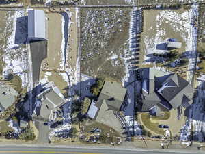 Snowy aerial view featuring a residential view