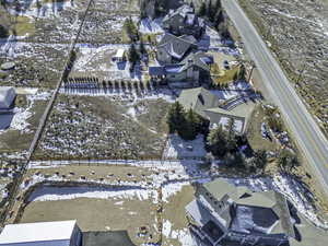 Snowy aerial view featuring a residential view