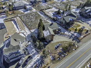 Snowy aerial view with a residential view