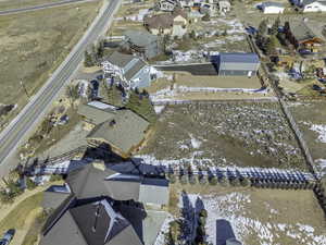 Snowy aerial view featuring a residential view