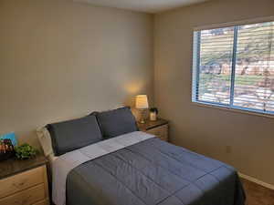 Carpeted bedroom with baseboards