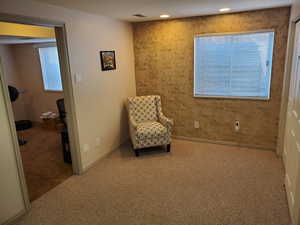 Living area featuring carpet flooring and recessed lighting