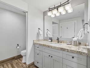 Bathroom featuring vanity and light wood-style flooring