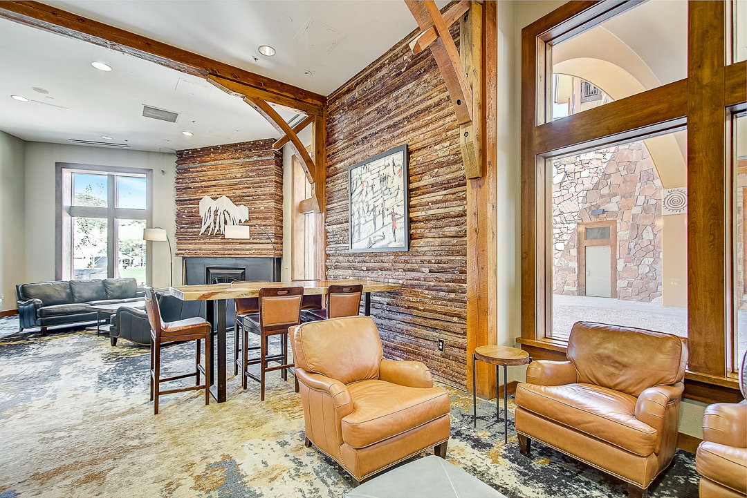 Living area featuring beamed ceiling, a fireplace, and recessed lighting