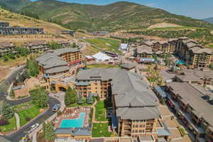 Aerial overview of property's location with mountains and a pool area