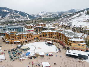 Snowy aerial view featuring a mountain view