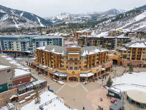 Snowy aerial view featuring a mountain view