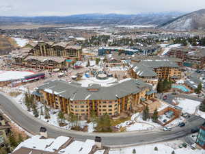 Snowy aerial view featuring a mountain view
