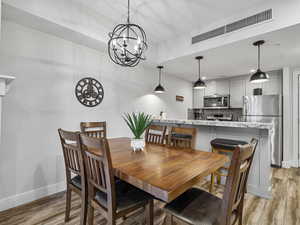 Dining room with a chandelier and light wood-style floors