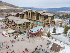 Snowy aerial view featuring a mountain view