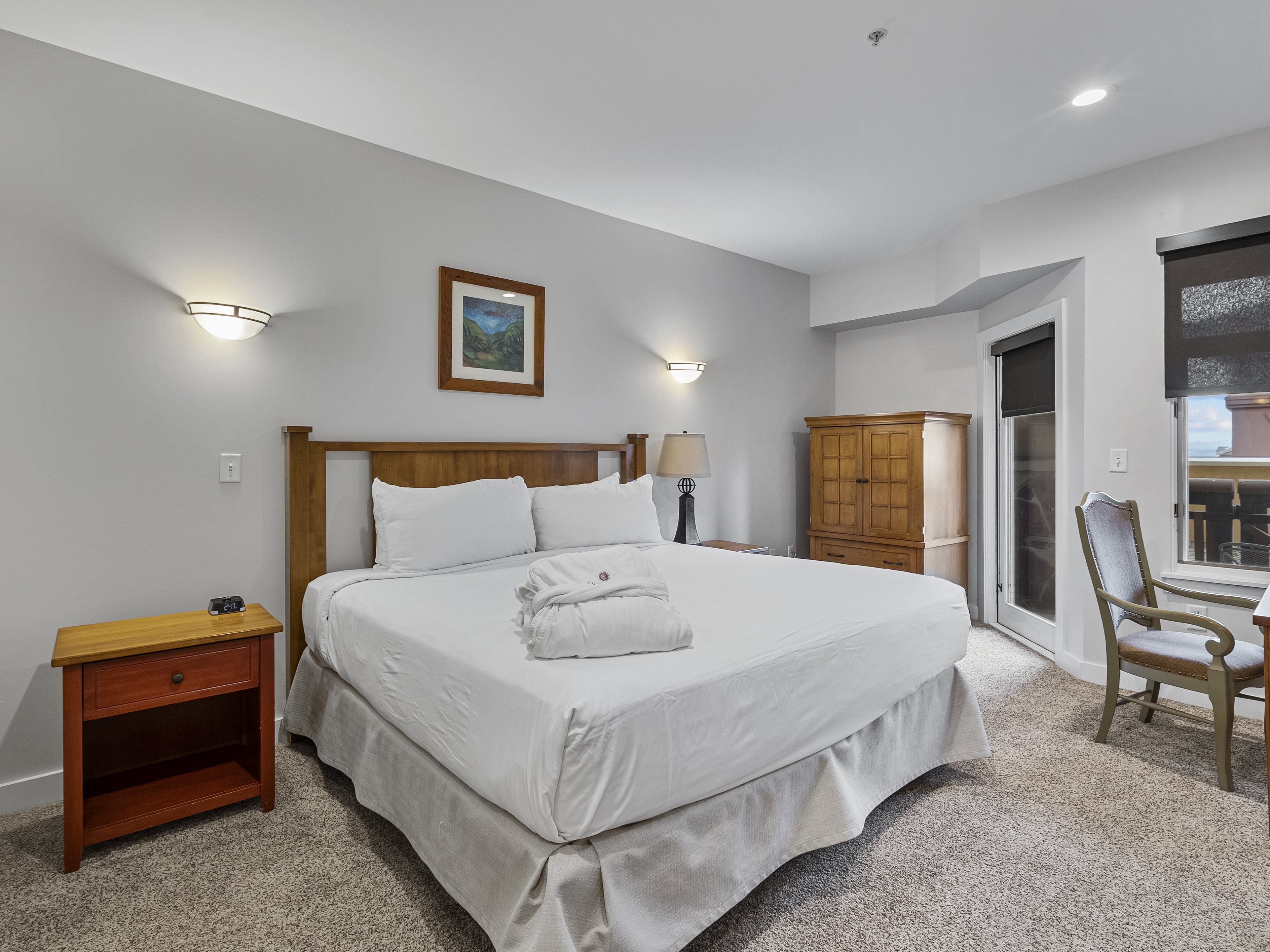 Carpeted bedroom featuring baseboards