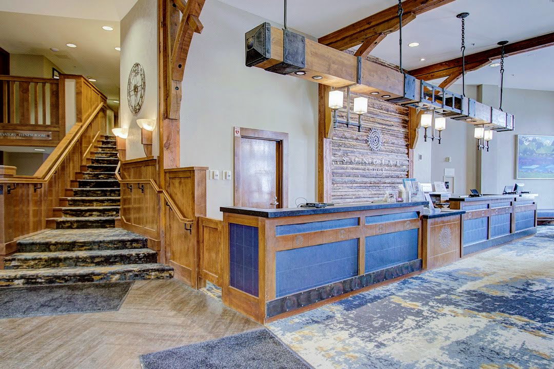 Welcome area featuring recessed lighting, stairway, and wooden walls