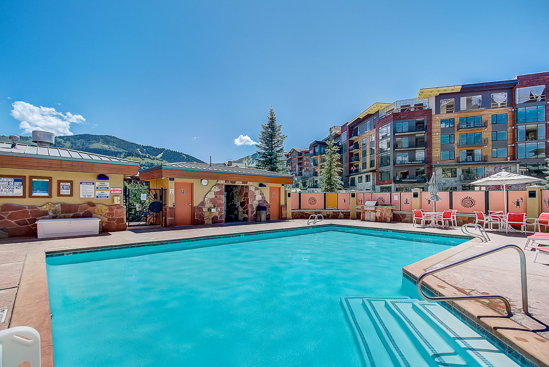 Community pool featuring a mountain view and a patio