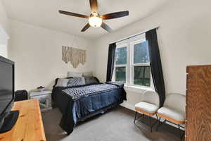 Bedroom with carpet flooring and a ceiling fan