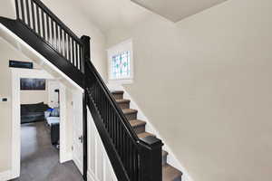 Stairs featuring carpet and baseboards