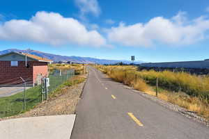 View of asphalt street with a mountain view