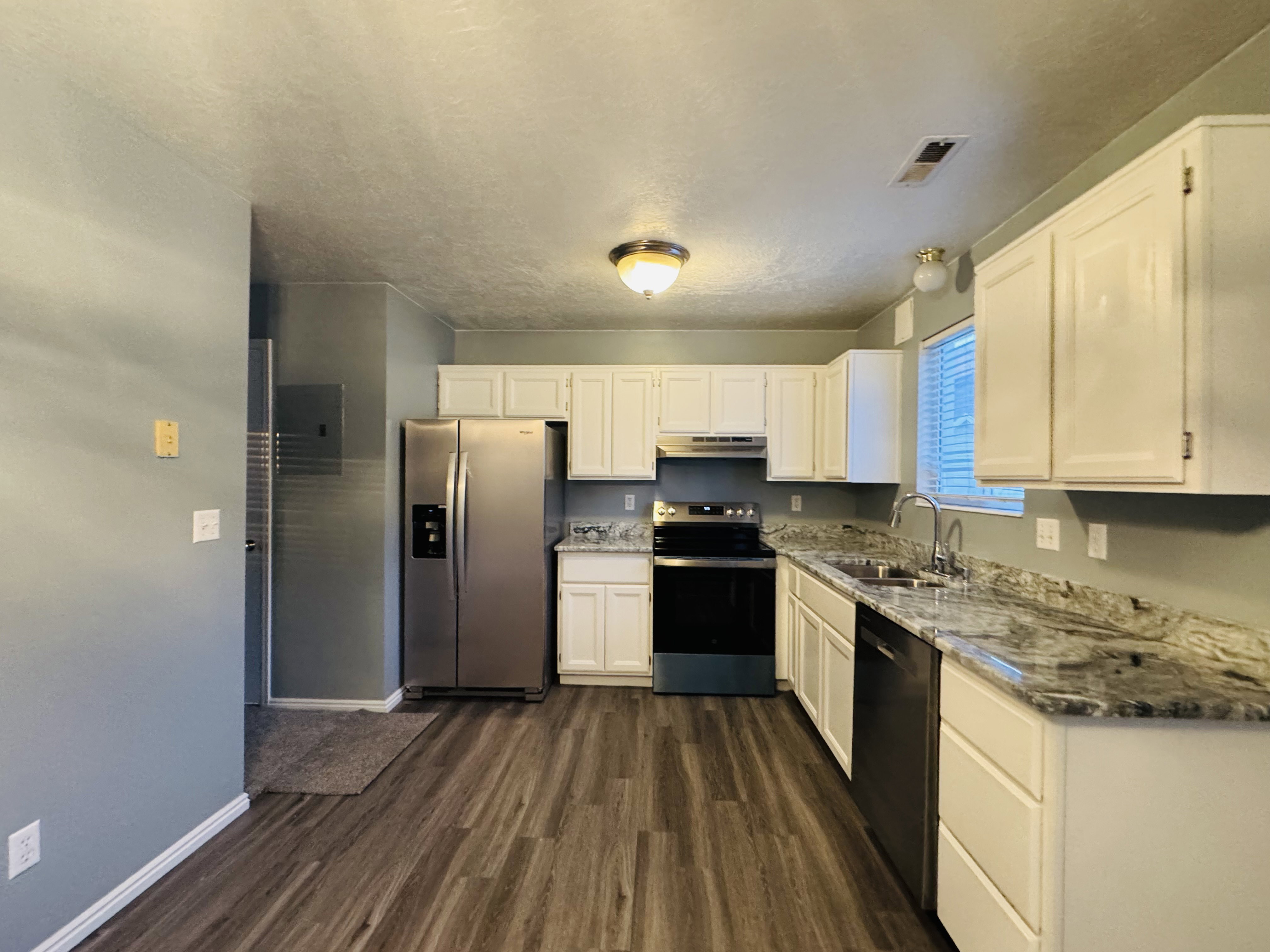 Updated Kitchen with Granite Counter tops & New Stainless Appliances