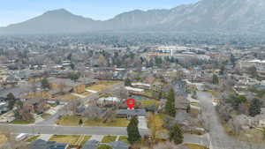 View of property location with a mountainous background and nearby suburban area