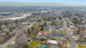 Aerial overview of property's location with nearby suburban area