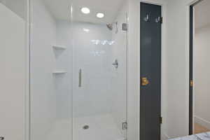 Full bath with a shower stall
