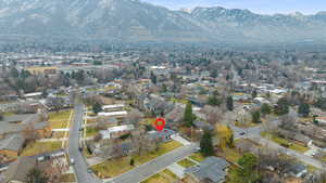 Aerial overview of property's location featuring nearby suburban area and mountains