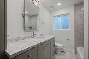 Full bath featuring vanity, light tile patterned floors, and recessed lighting