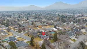 View of property location featuring a mountain backdrop and nearby suburban area