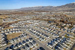 Aerial view of property's location featuring nearby suburban area and a mountain backdrop