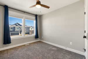 Bedroom #4 with carpet and a ceiling fan