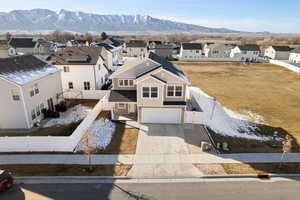 Aerial view of residential area featuring a mountainous background