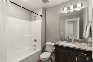 Full bathroom with shower / bath combo with shower curtain and vanity