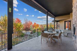 Balcony featuring outdoor dining area and french doors
