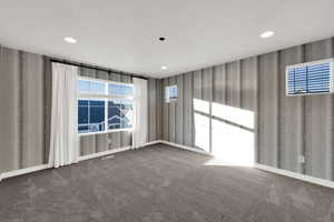 Unfurnished room featuring carpet, wallpapered walls, a textured ceiling, and recessed lighting