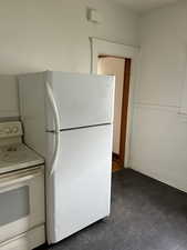 Kitchen featuring white appliances