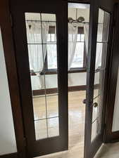 Detailed view of wood finished floors and french doors