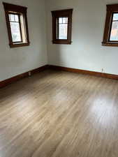 Spare room featuring light wood finished floors and plenty of natural light