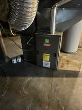 Utility room featuring heating unit