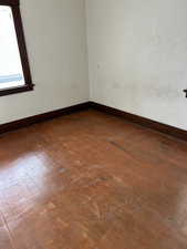 Spare room with dark wood finished floors