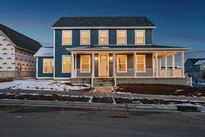 View of front facade featuring covered porch