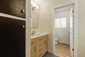 Bathroom featuring vanity and light wood-style flooring
