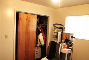 Bedroom with a closet currently used as an office