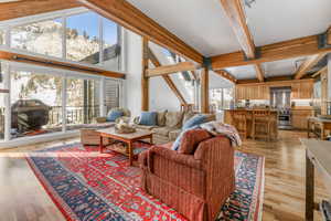 Living room featuring  a vaulted beam  ceiling, and a mountain view