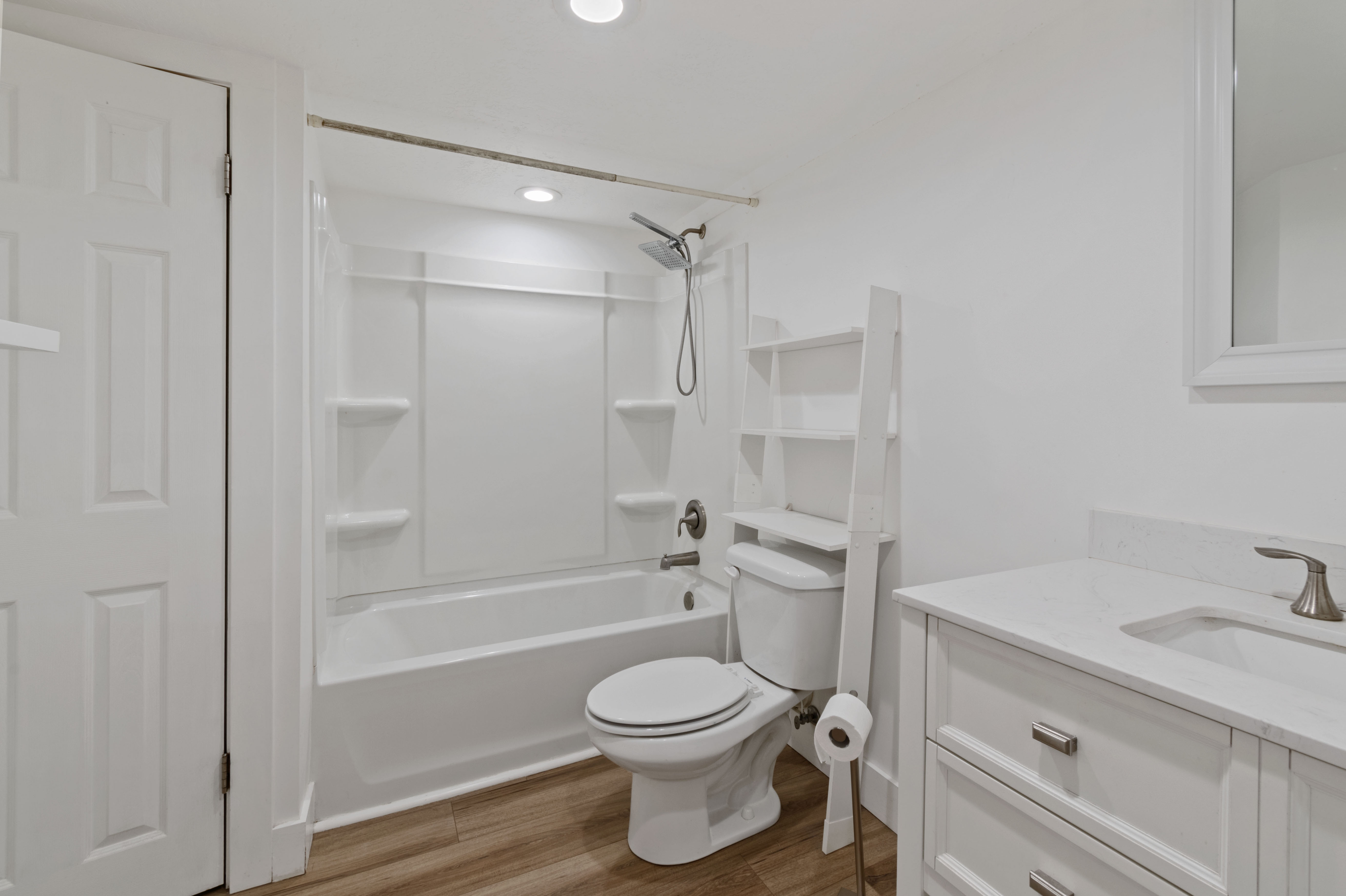 Full bath with vanity, shower / tub combination, light wood-style floors, and recessed lighting
