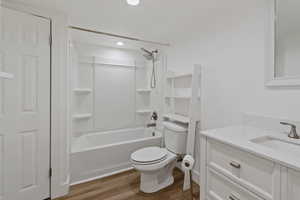 Full bath with vanity, shower / tub combination, light wood-style floors, and recessed lighting