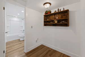 Corridor featuring light wood-style flooring and recessed lighting
